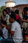 Ayutthaya, Thailand. Wat Yai Chai Mongkhon. When praying Thai people take three incense sticks for Buddha, Sangha and Dharma, a lotus and a small candle which symbolizes the Buddhist teachings purity, comprehension and enlightenment. 